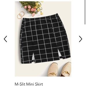 selling a black and white mini skirt!